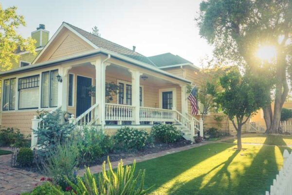 Photo of Yellow House with Beautifully Landscaped Yard