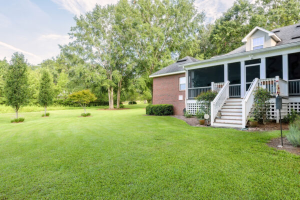 Back of Colonial Brick House with Landscaped Yard